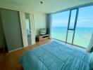 Ocean view bedroom with large windows and minimalist decor