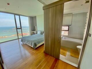 Cozy bedroom with ocean view and natural light