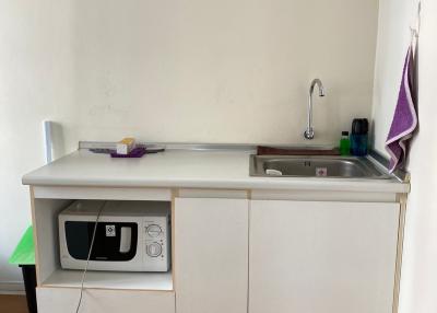 Compact kitchenette with microwave and sink