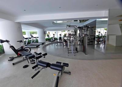 Spacious home gym with various exercise equipment