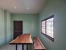 Minimalist kitchen with wooden countertops and natural light