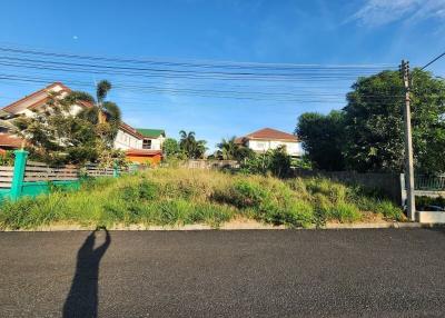 Suburban neighborhood with houses and clear blue sky