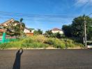 Suburban neighborhood with houses and clear blue sky