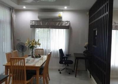 Modern dining room with an open workstation