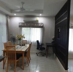 Modern dining room with an open workstation