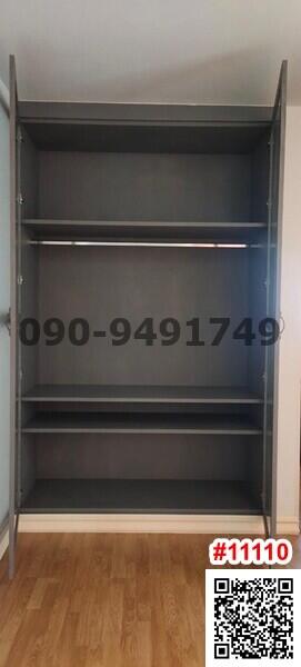 Empty wooden bookshelf in a room with hardwood flooring