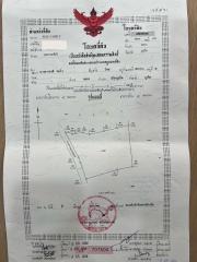 Detailed image of a property-related document with various stamps and inscriptions in a foreign script