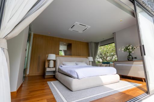 Modern bedroom with natural light and elegant decor