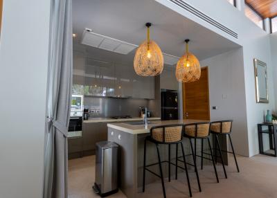 Modern kitchen with pendant lighting and breakfast bar