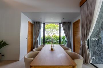 Spacious dining room with natural light and outdoor view