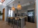 Modern kitchen with bar seating and integrated appliances