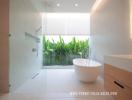 Modern bathroom with freestanding tub and natural view