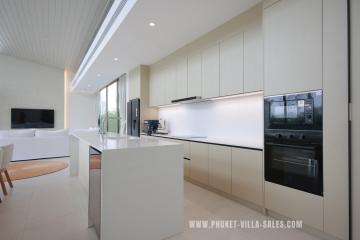 Modern kitchen with integrated appliances and white finish