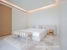 Modern bedroom with minimalist design featuring a large bed and ambient lighting