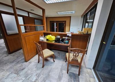Home office interior with wooden desk and chairs