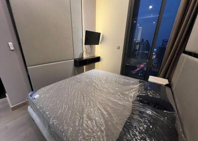 Modern bedroom with city view at night