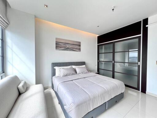 Modern bedroom with a comfortable bed and built-in wardrobe