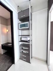 Modern bathroom interior with sleek storage shelves and vanity