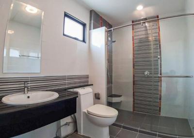Modern bathroom with glass shower and contemporary fixtures