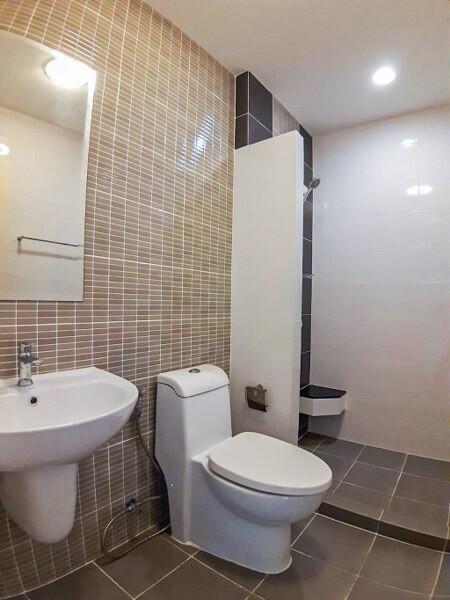 Modern bathroom with wall-mounted sink and toilet