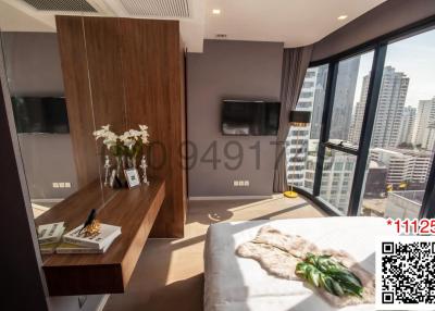 Modern bedroom with city view and ample natural light