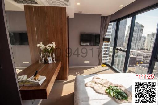 Modern bedroom with city view and ample natural light