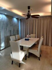 Modern dining room with a marble table and comfortable seating
