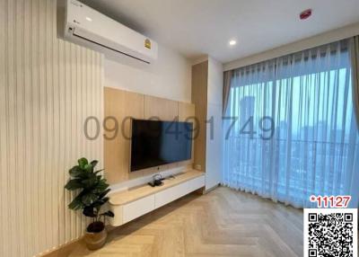 Modern living room with television and air conditioning unit