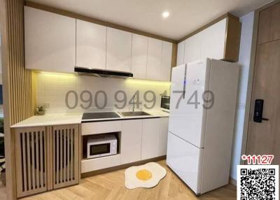 Modern kitchen with wooden cabinets and white appliances