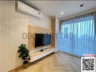 Bright and modern living room with mounted TV and air conditioning