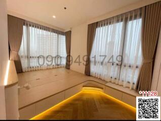 Spacious bedroom with large windows and ample natural light