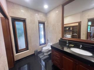 Spacious bathroom with marble finishing and modern fixtures