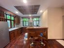 Modern kitchen interior with bar stools and wooden finishes