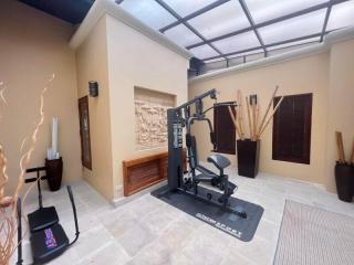 Spacious home gym area with fitness equipment