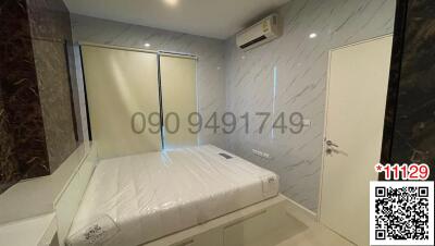 Modern bedroom with ensuite bathroom and air conditioning