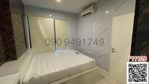 Modern bedroom with ensuite bathroom and air conditioning