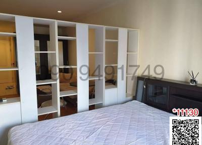 Spacious Bedroom with Large Bed and Wardrobe