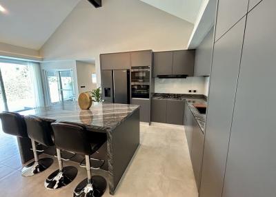 Modern kitchen with island and integrated appliances