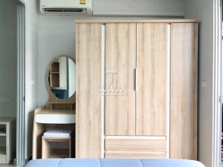 Contemporary bedroom with wardrobe, AC and vanity