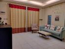 Spacious living room with comfortable seating and decorative curtains