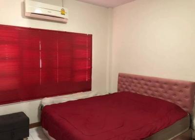 Cozy Bedroom with Air Conditioning and Red Blinds