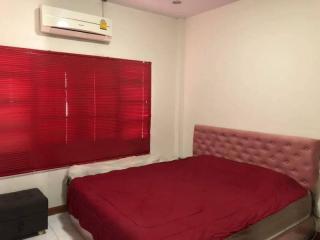 Cozy Bedroom with Air Conditioning and Red Blinds