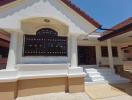 Contemporary styled entrance of a residential building with clear skies