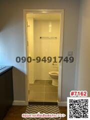 Compact bathroom with tiled walls and flooring