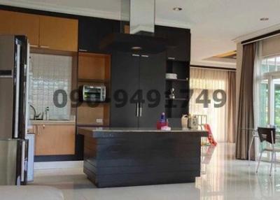 Modern kitchen with black appliances and breakfast area