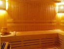 Cozy home sauna with wooden benches and interior