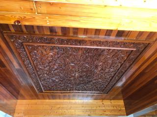 Intricate wooden ceiling and wall panels