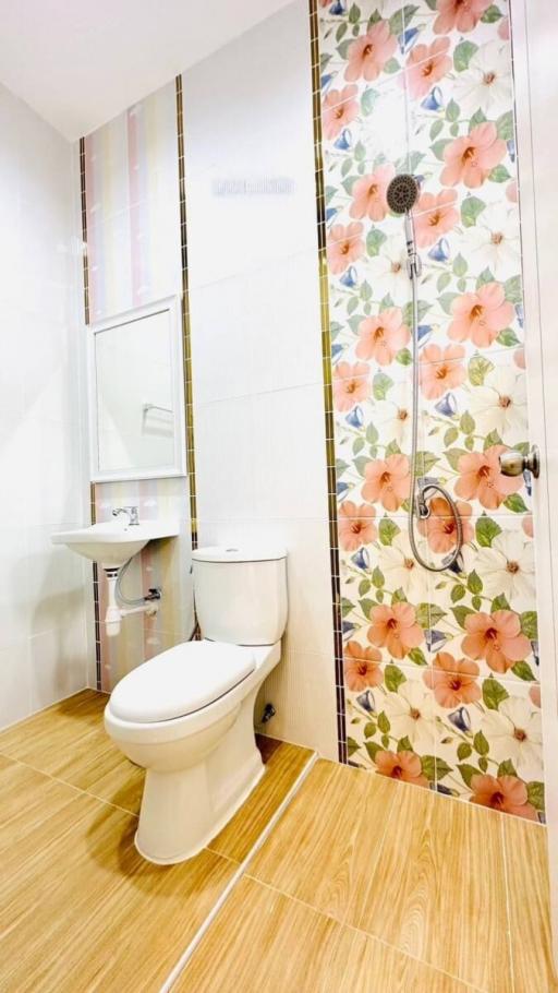 Modern bathroom interior with floral tile design
