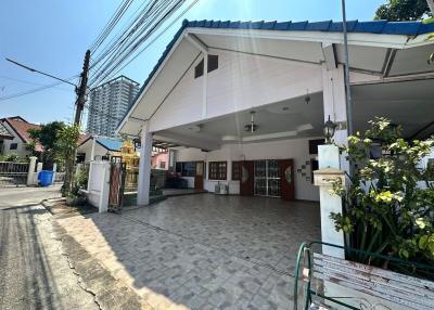 Spacious covered driveway leading to the entrance of a residential home