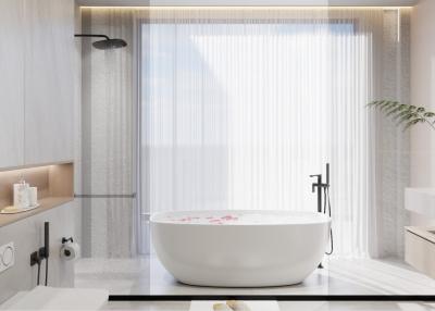 Modern bathroom interior with a freestanding bathtub and natural light